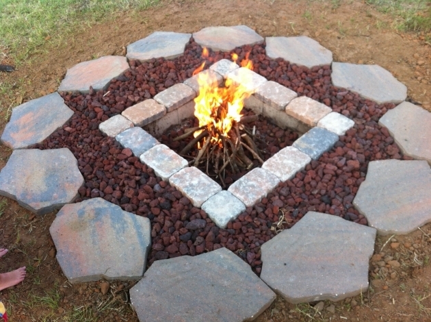 Stunning Rumblestone Firepit With River Stone Surround And Red Lava Rock Lava Rocks For Fire Pit