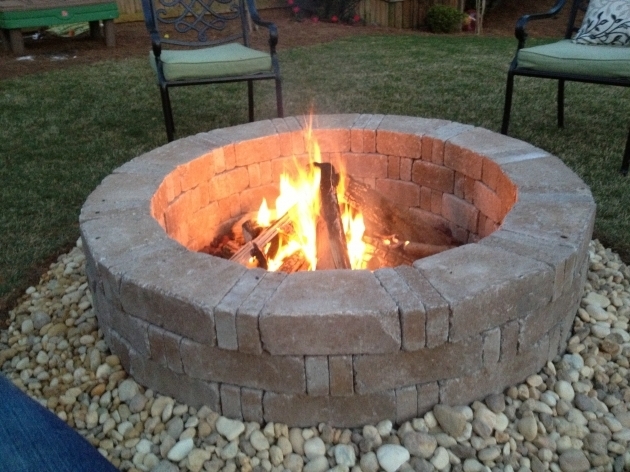 Stylish Rumblestone Firepit With River Stone Surround And Red Lava Rock Lava Rock For Fire Pit